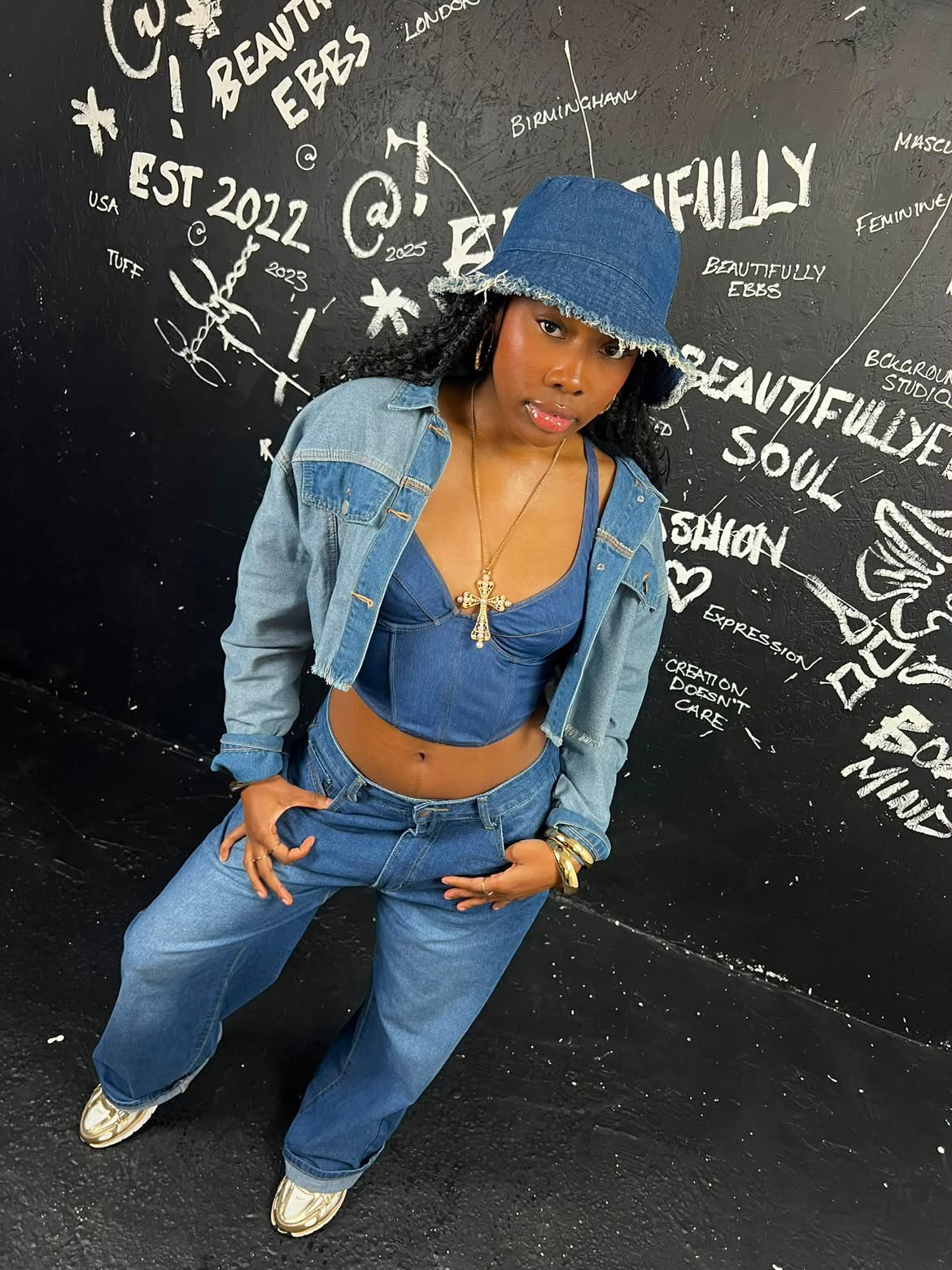 A young woman dressed in denim posing for the camera